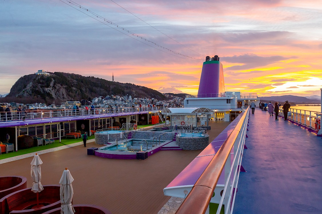 Sunset from the deck of the Ambition cruise ship in Alesund, Norway