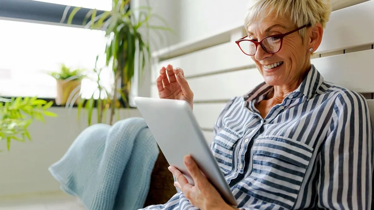 Stylish woman using tablet computer