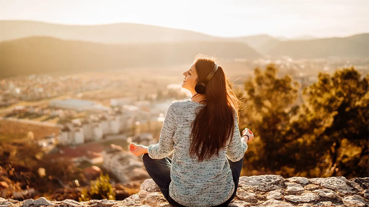 Girl sat listening to podcast