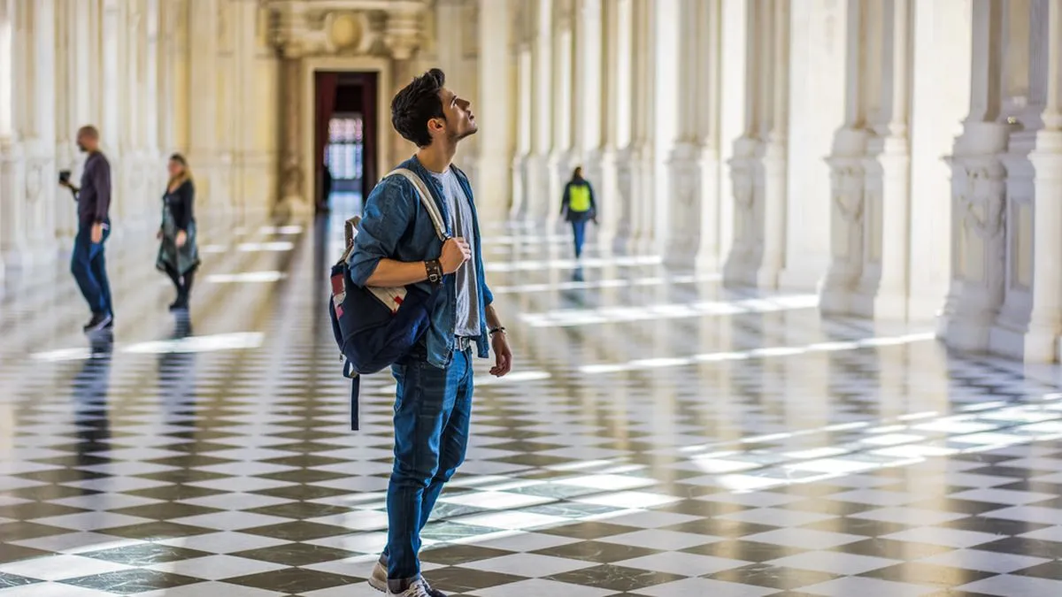 Man looking around a museum