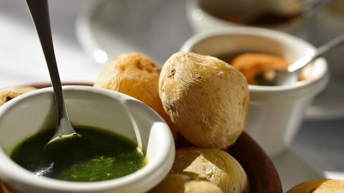 A plate of papas arrugadas served with mojo verde and mojo rojo