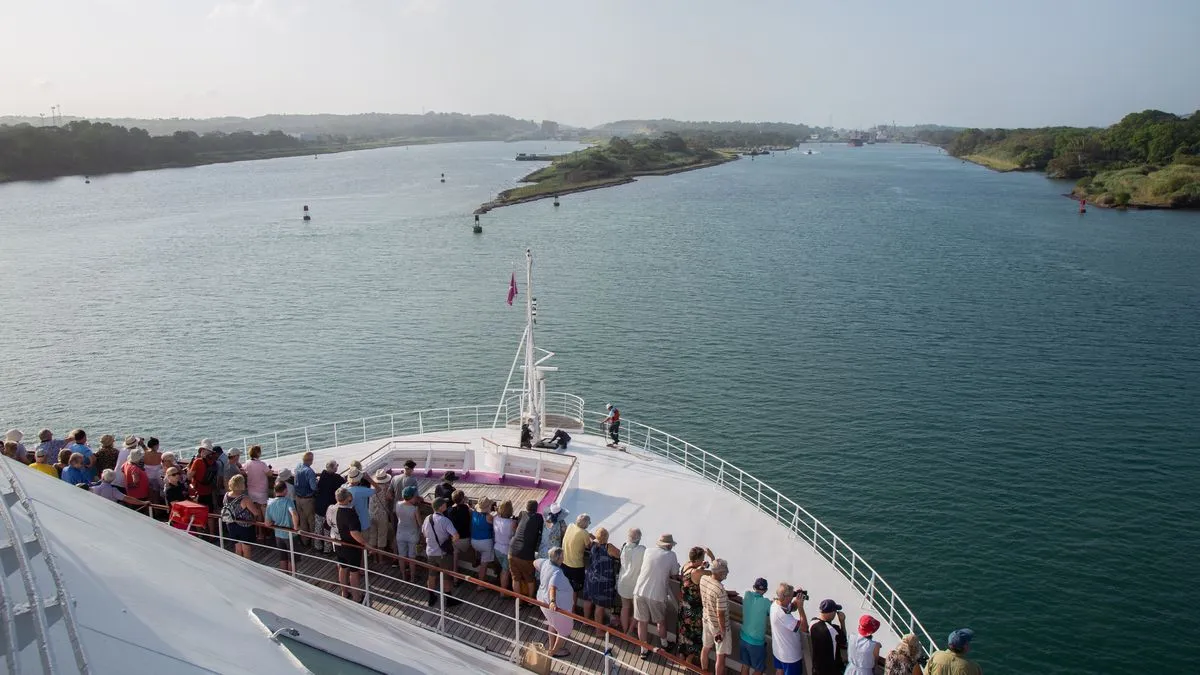 Guests on Ambience cruise ship watching the arrival at the Panama Canal on a World Cruise